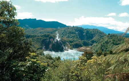 A sweeping, sunny, overhead view of Waimangu Volcanic Rift Valley in Rotorua.